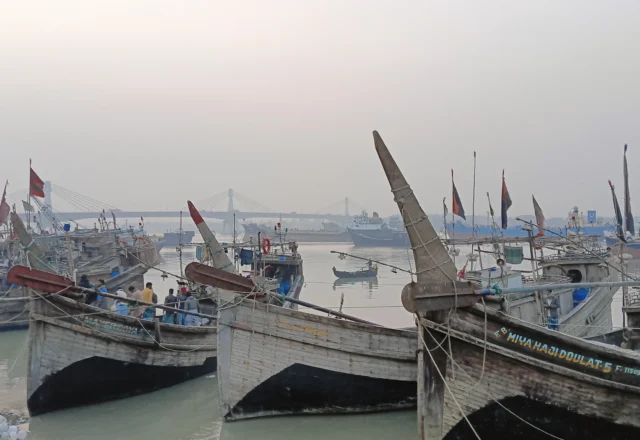 A bunch of fishing boats in river bank