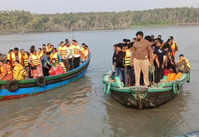 A group of tourists wearing life jacket in river boat