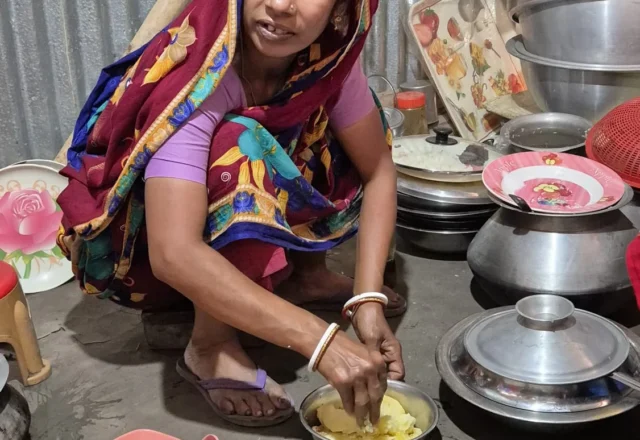 A local woman preparing mashed potato in a village of Sundarbans