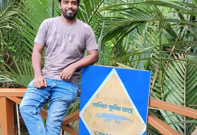 A tour guide taking photo in the deep forest of Sundarbans