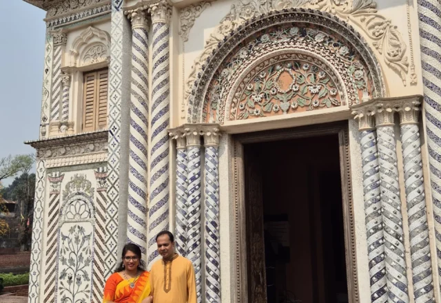 A tourist couple in front of entrance gate of Boro Sardar Bari
