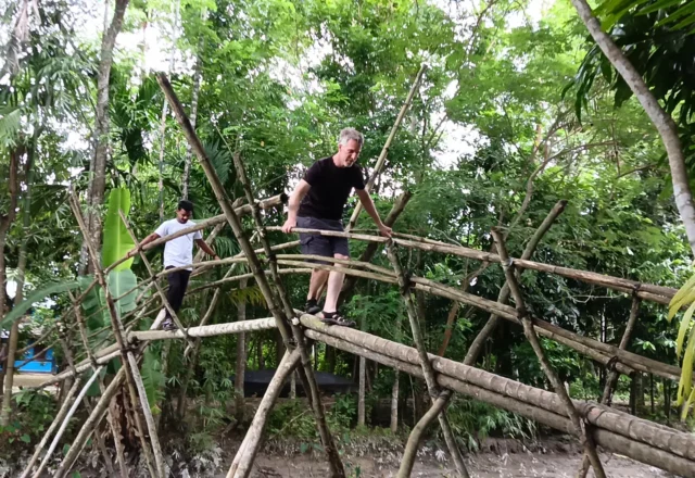 A tourist trying to escape the bamboo bridge