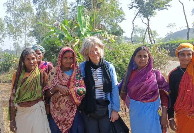A tourist with local tea workers in Sreemangal