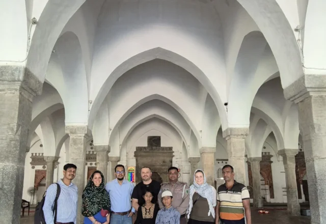 Inside Sixty Dome Mosque with tourists