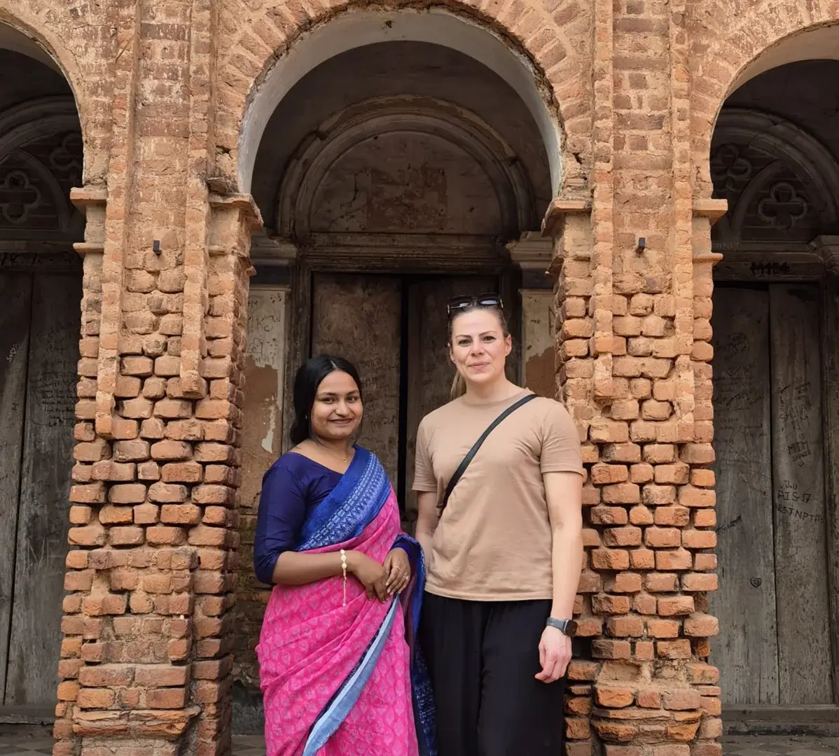 Local ladies wearing traditional dress with Panam City old building