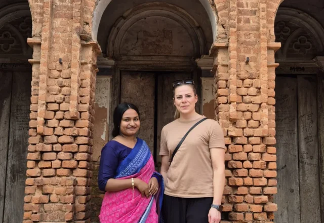 Local ladies wearing traditional dress with Panam City old building