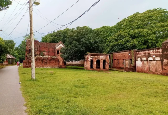 A field and old buildings in Panam City