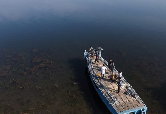 A boat on the clear water of Tanguar Haor, Sunamganj