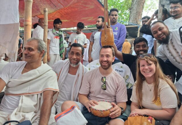 Our guests sitting with baul musicians and their instruments at the Lalon Mela